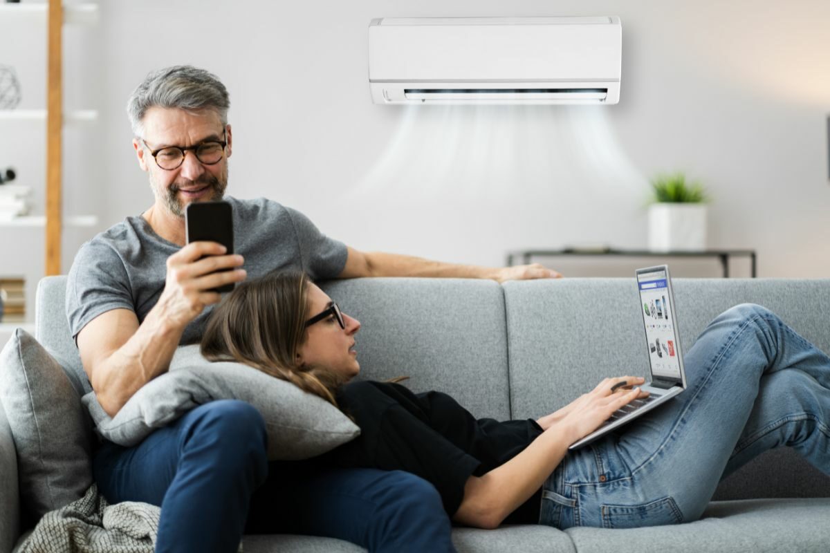 Couple in luxury Australian home enjoying newly installed air conditioning system